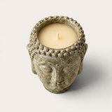 Vela artesanal Glitter Moon de THE IBIZA CANDLES con forma de cabeza de Buda en piedra texturizada y acabado envejecido
