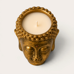 Vela artesanal THE IBIZA CANDLES con forma de cabeza de Buda en color bronce dorado, pieza decorativa escultórica.