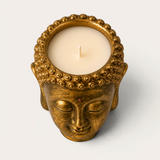 Vela artesanal THE IBIZA CANDLES con forma de cabeza de Buda en color bronce dorado, pieza decorativa escultórica.