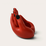 Vela escultórica THE IBIZA CANDLES con forma de mano roja y uñas con purpurina negra, pieza artesanal de Fabio Camarotta
