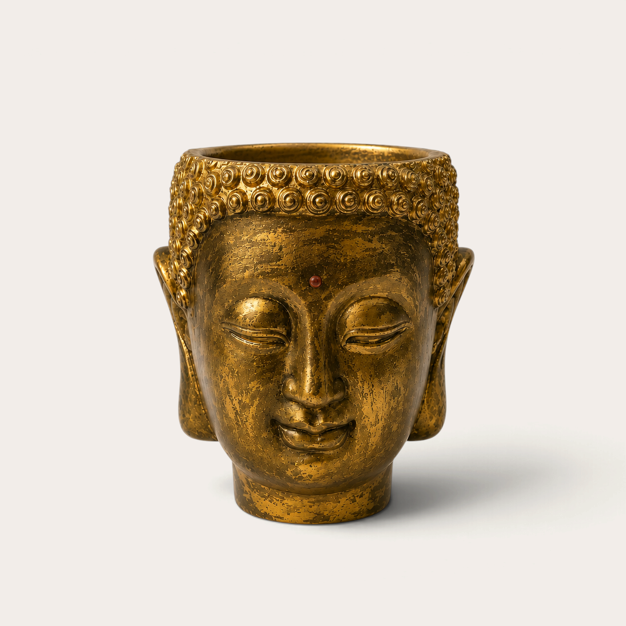 Vela escultórica THE IBIZA CANDLES Golden Bronze con forma de cabeza de Buda pintada a mano en acabado dorado envejecido