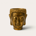 Vela escultórica THE IBIZA CANDLES Golden Bronze con forma de cabeza de Buda pintada a mano en acabado dorado envejecido