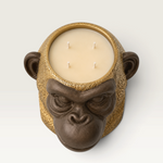 Vela decorativa THE IBIZA CANDLES con forma de cabeza de simio en tonos bronce y oro con cuatro mechas