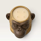 Vela decorativa THE IBIZA CANDLES con forma de cabeza de simio en tonos bronce y oro con cuatro mechas