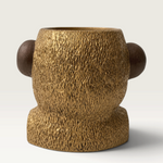 Vela decorativa THE IBIZA CANDLES con forma de cabeza de simio en tonos oro y bronce con textura detallada